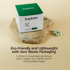 Kayaan toothpaste packaging on a stone surface with text highlighting eco-friendly features.