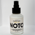 Bottle of Noto sunscreen spray on a white background